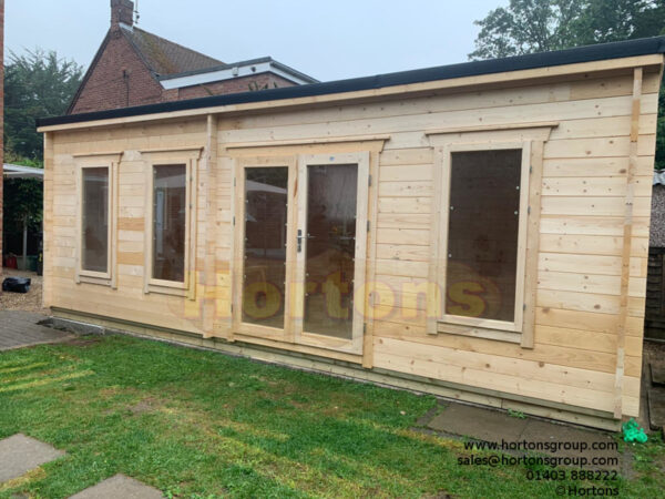 7m x 3m pent garden cabin on timber platform base to level uneven concrete base