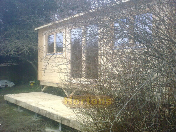 6x3m garden cabin on sloped garden with decking