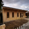 7.5m x 4.5m pent log cabin with roof canopy in garden