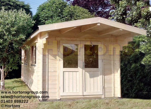 3m x 5m garden cabin with 1m roof canopy installed in garden