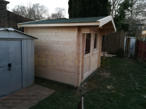 3m x 2.5m log cabin installed on concrete base in garden