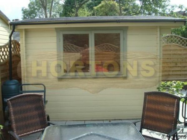 3x3m custom garden cabin with 0.5m roof canopy installed