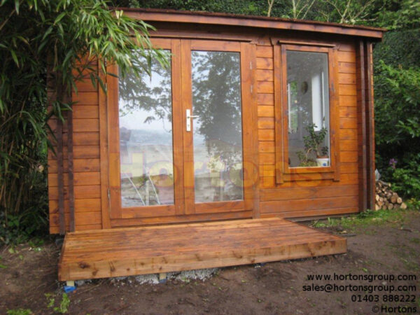3.5x3.5m log cabin front in garden