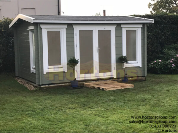 4.5m x 3.5m garden room factory painted white and green