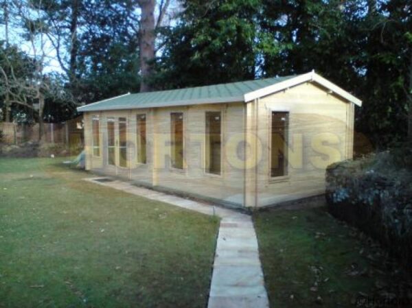 7.5 x 3.5m log cabin in garden on concrete base