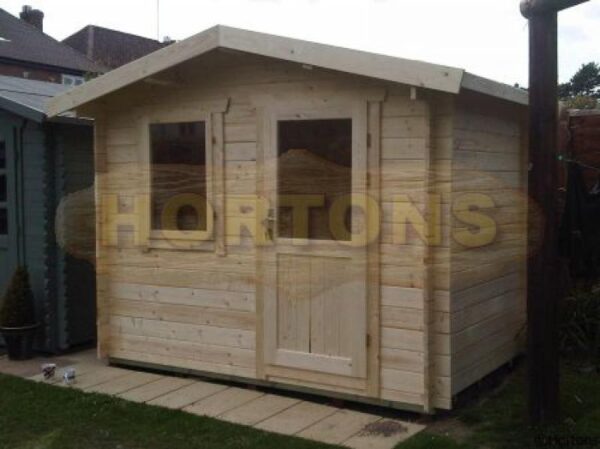 3m x 2m garden cabin in garden on paving slab base
