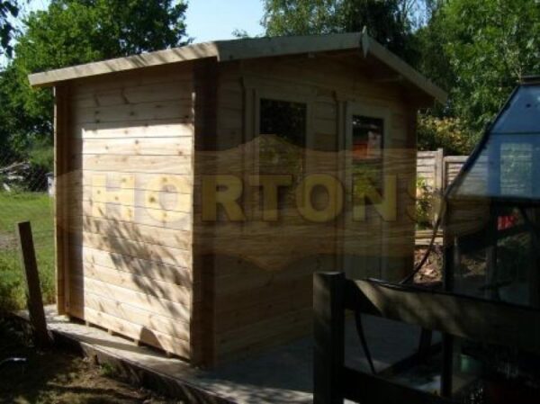 3m x 2m garden cabin in garden on oversized base