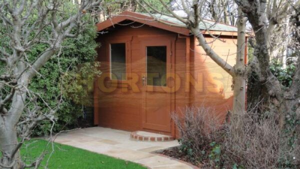3m x 2m garden cabin in landscaped garden